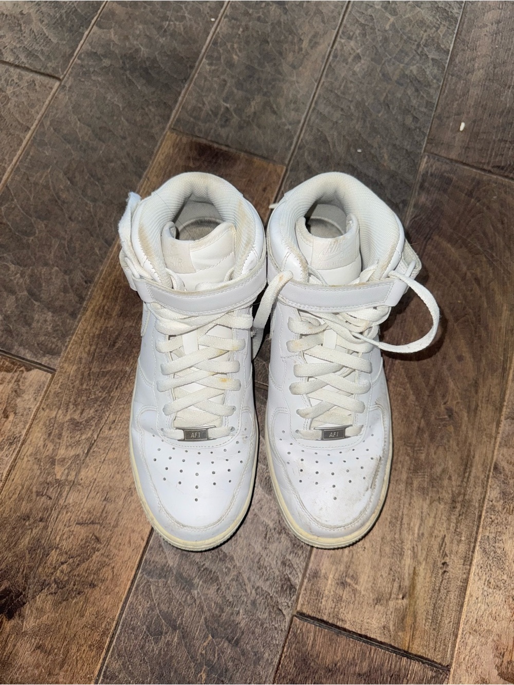 Nike Air Force’s White Mid-Top Sneakers with Ankle Strap